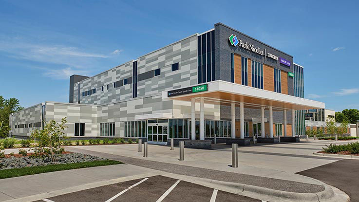 One of the Park Nicollet clinics and surgery centers in Burnsville, MN. It is a large, modern building.