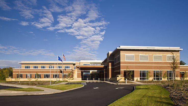 A picture of the entrance to Amery Hospital on a sunny, calm day.
