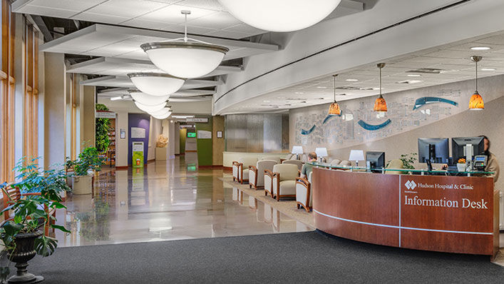 Large waiting area with an information desk where you can check in.