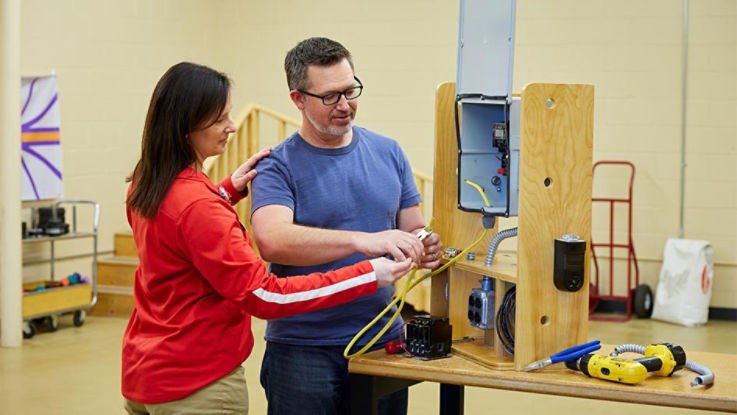 Patient works with an occupational therapist.