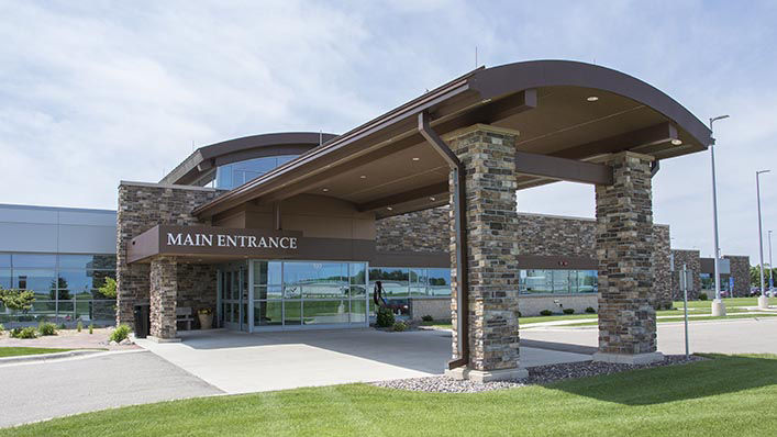 The hospital's main entrance looks modern and welcoming.