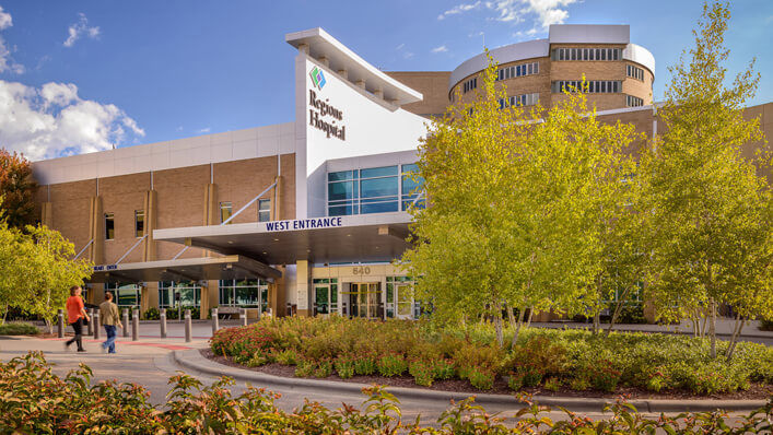 Visitors stroll towards Regions Hospital West Entrance