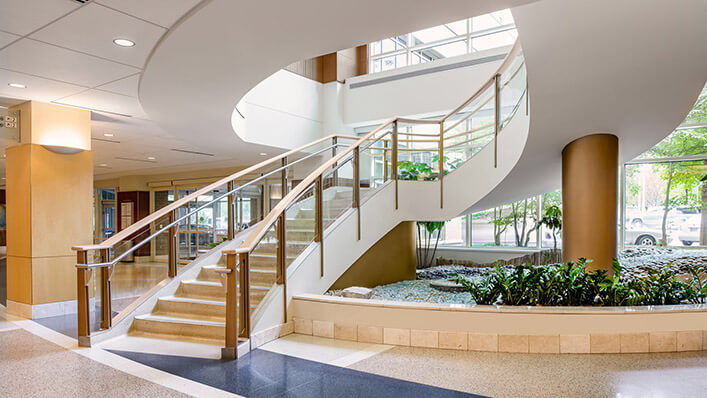 A winding staircase is at the center of our light-filled Regions Hospital atrium.