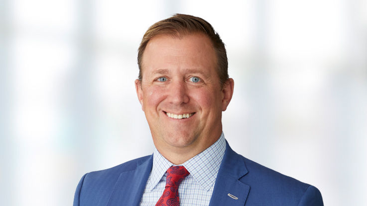 Portrait of Tyler Schmidtz, a smiling white man with short, brown hair.