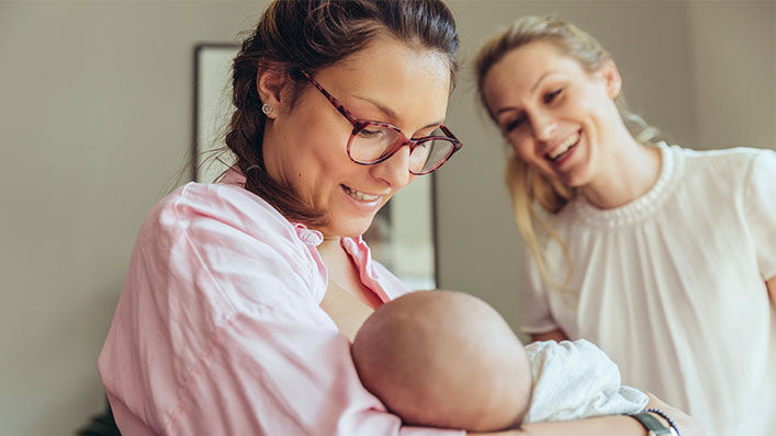 Midwife supporting a breast-feeding mother, Cologne, NRW, Germany