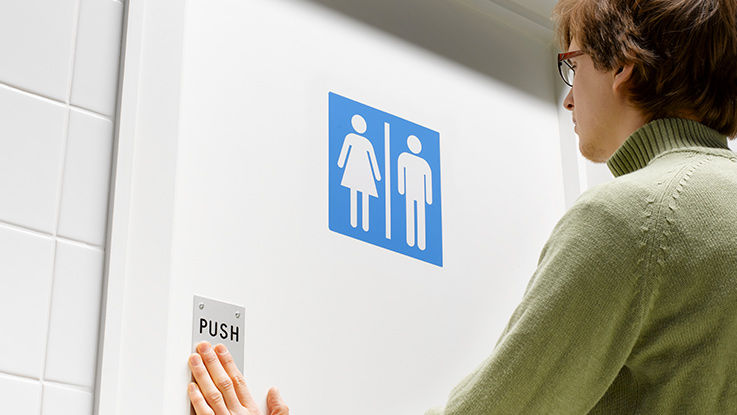 a woman takes a scheduled bathroom break as part of bowel training for fecal incontinence. 