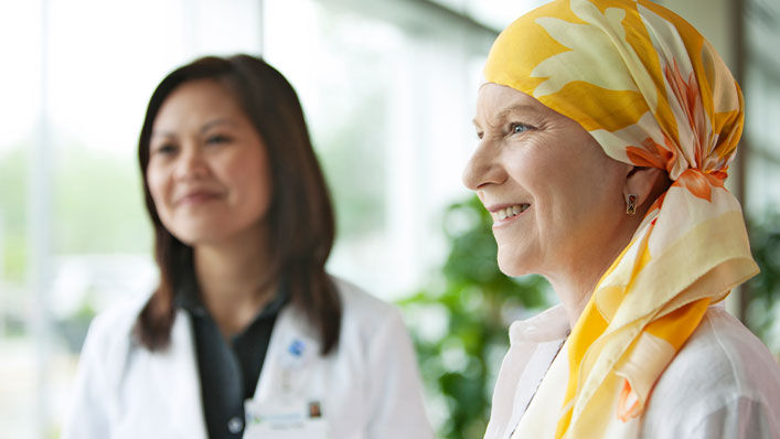 A woman in a headscarf receives treatment. 