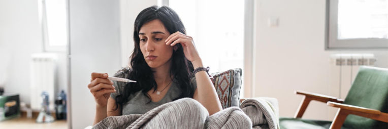 Woman sick at home.