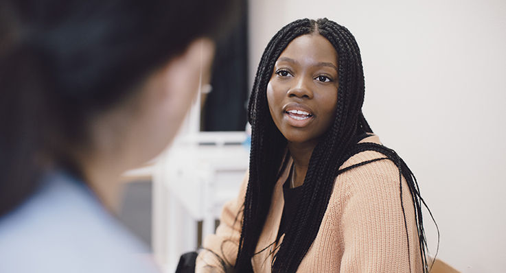 A woman consults with her doctor about her sleep health.