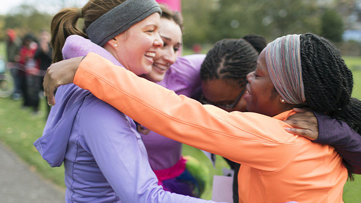 Ladies huddling up before running a charity race