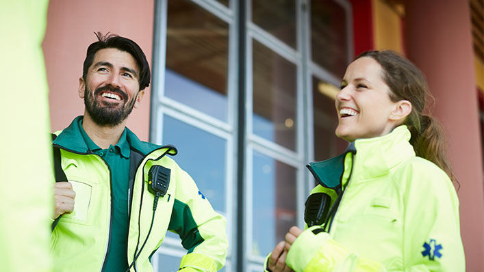 Emeregency Medical Service professionals talking amongst each other