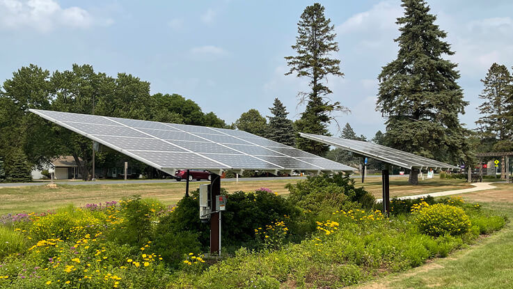 Solar panels absorb light on a sunny day.