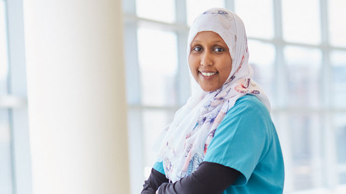 A HealthPartners clinician wearing a headscarf smiles for a picture.